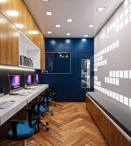 A modern computer study lab with individual workstations